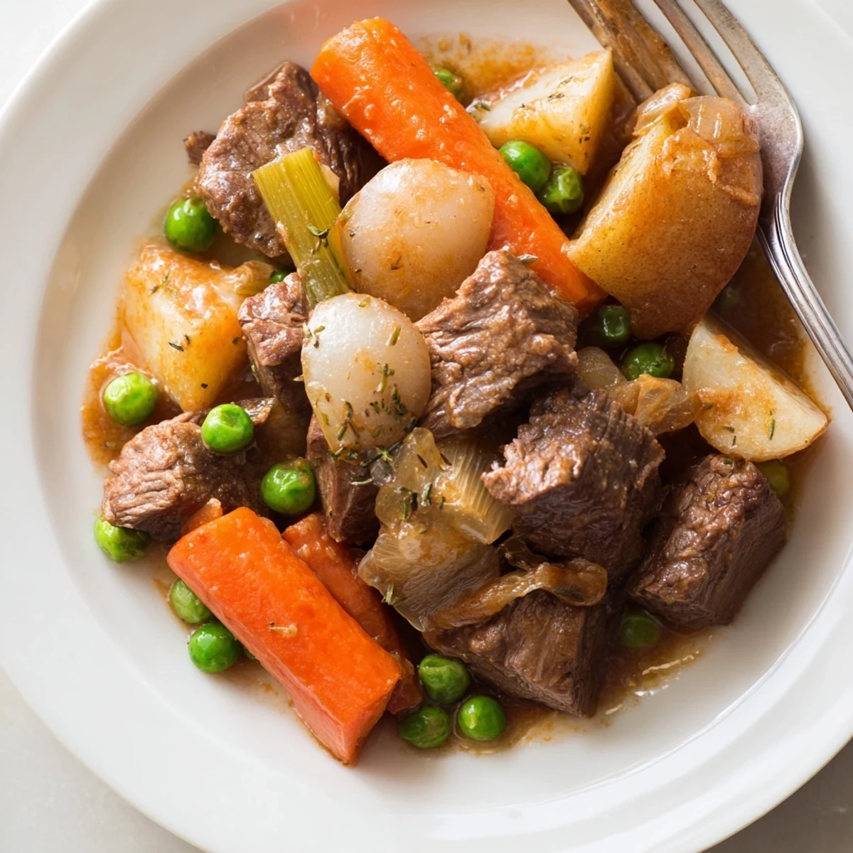 Hearty Beef and Vegetable Casserole served in a rustic dish, showcasing tender beef and vibrant veggies.  