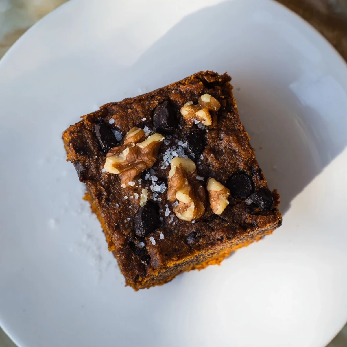 A square of decadent sweet potato brownies, perfect for a gluten-free dessert craving.