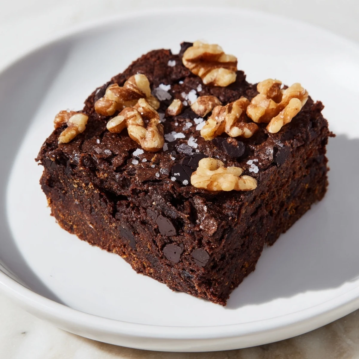 Fudgy sweet potato brownies, featuring a rich, dark chocolate swirl and a delectable texture.