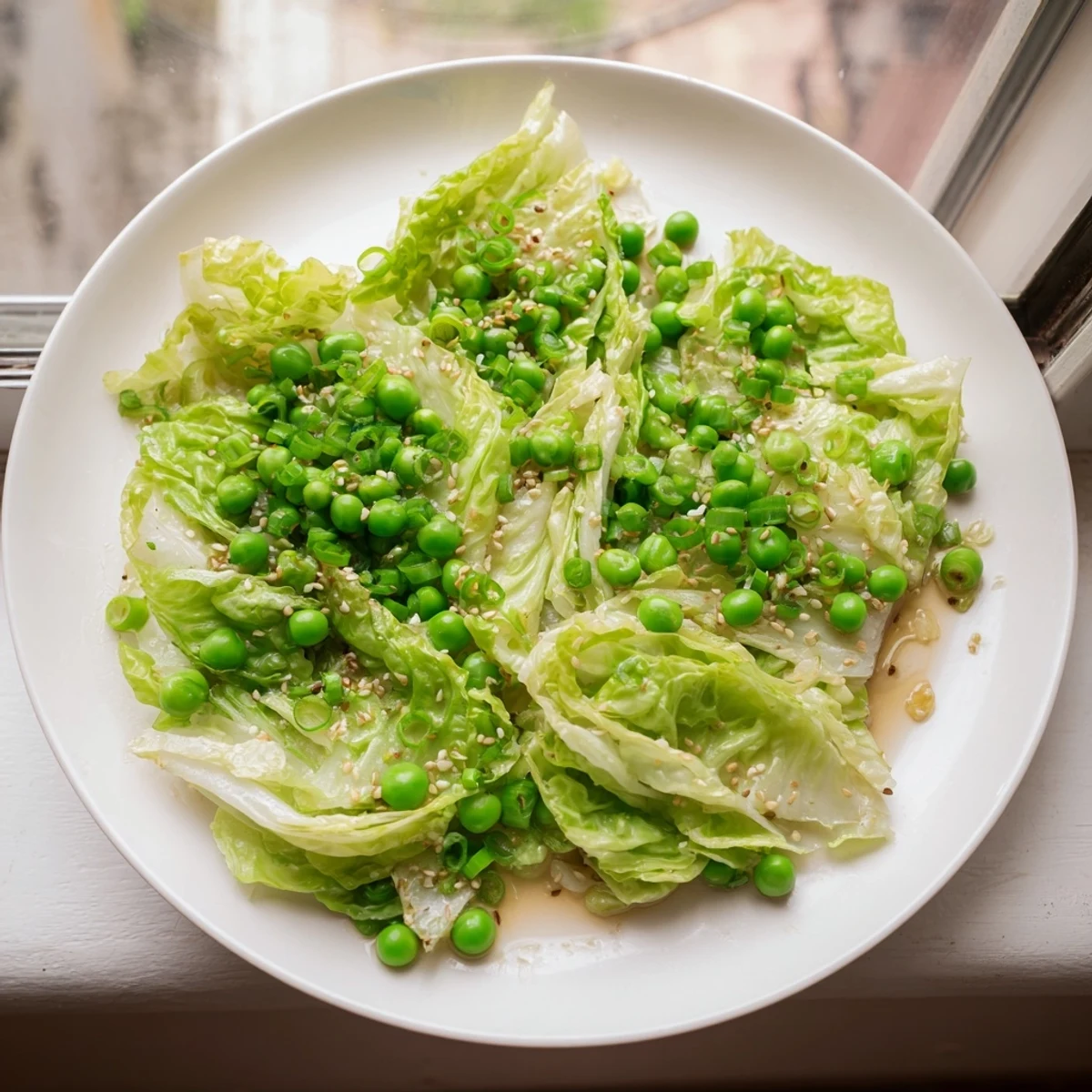 Freshly made cabbage stir-fry showcasing tender-crisp vegetables in a garlic-soy sauce, a healthy meal.