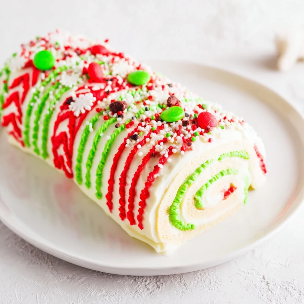 Festive Ugly Sweater Cake Roll, a colorful dessert with sprinkles, perfect for holiday parties.