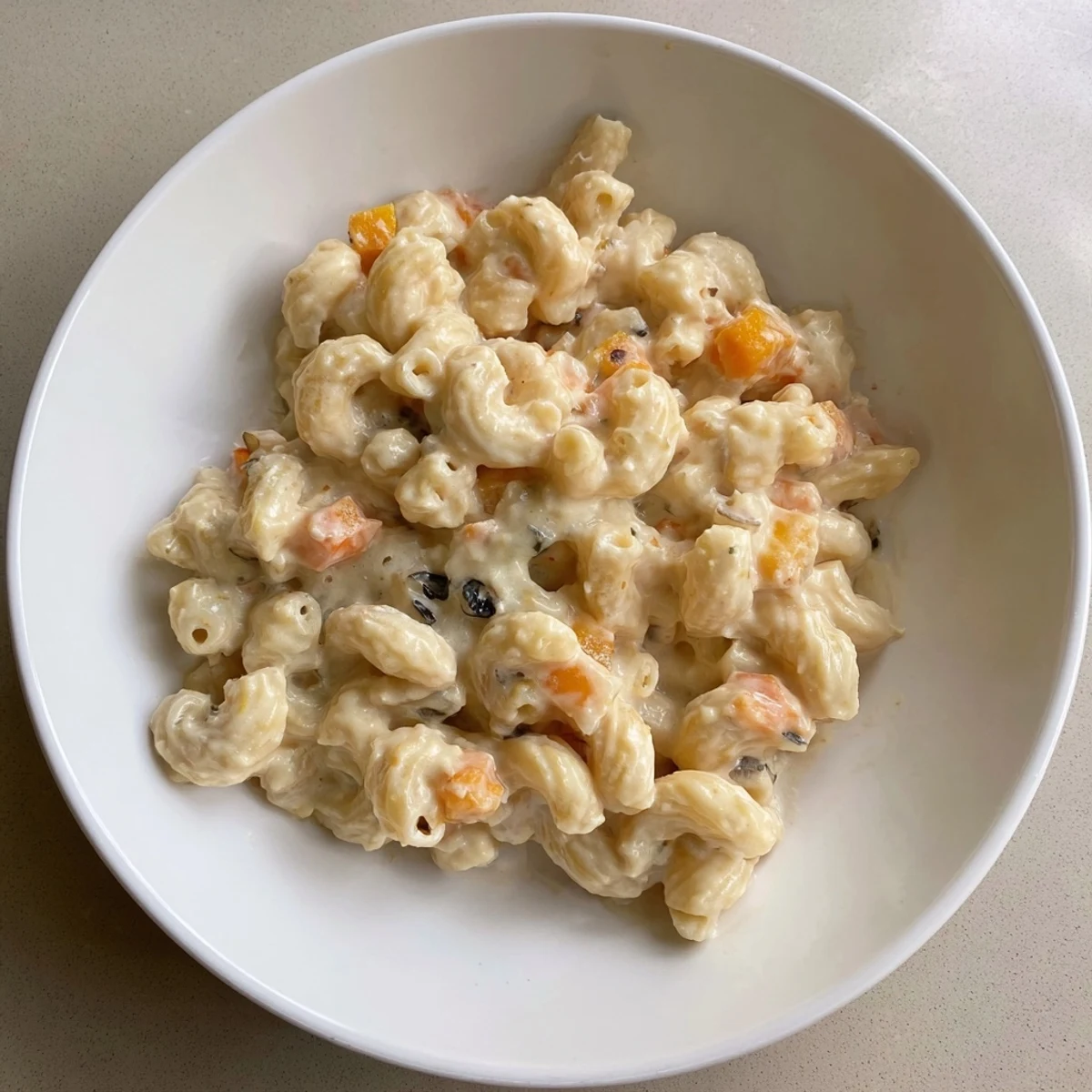 Golden, steaming bowl of One-Pot Butternut Squash Mac & Cheese, perfect comfort food, ready to serve.