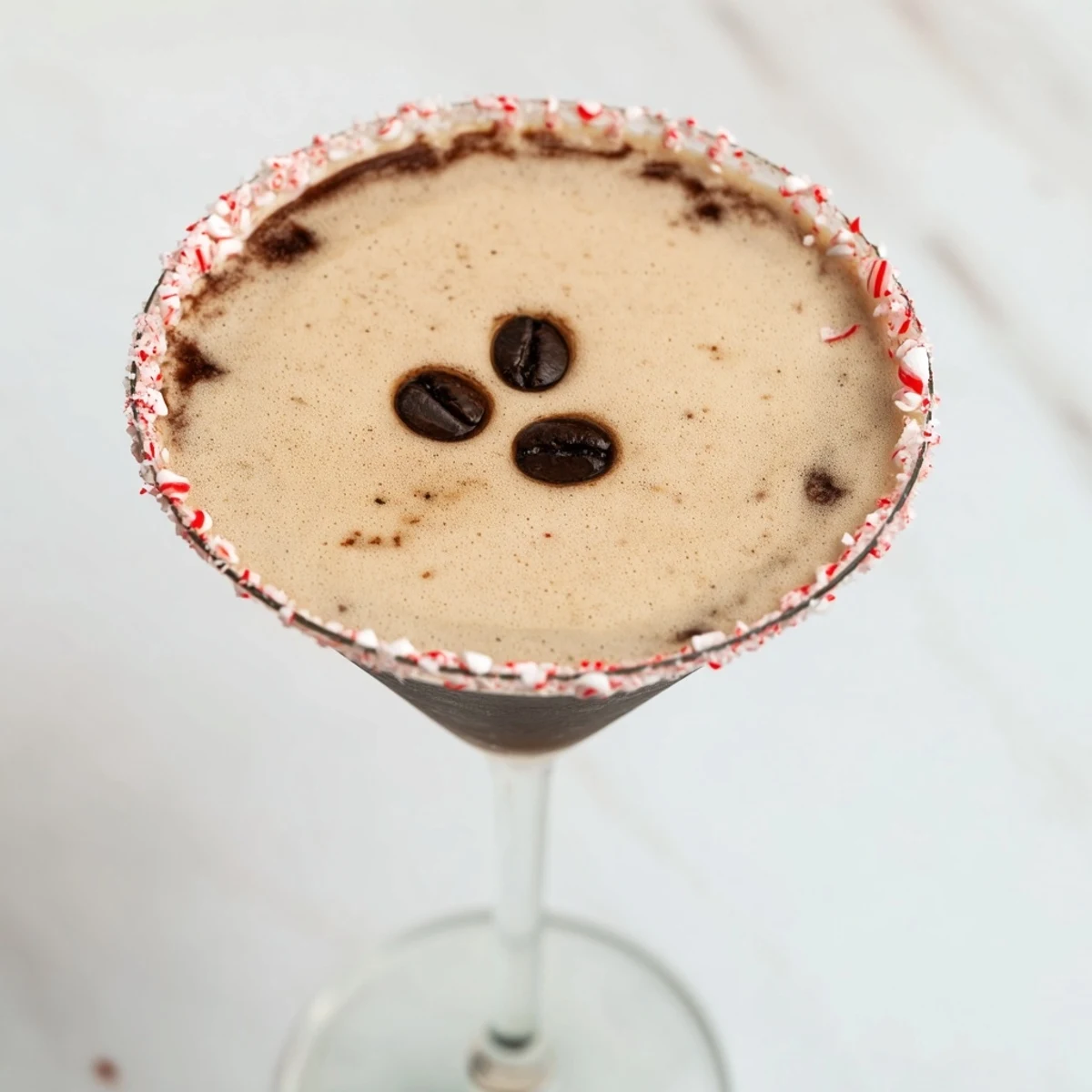 Chocolate-rimmed Peppermint Espresso Martinis sparkle, a creamy cocktail perfect for holiday celebrations.