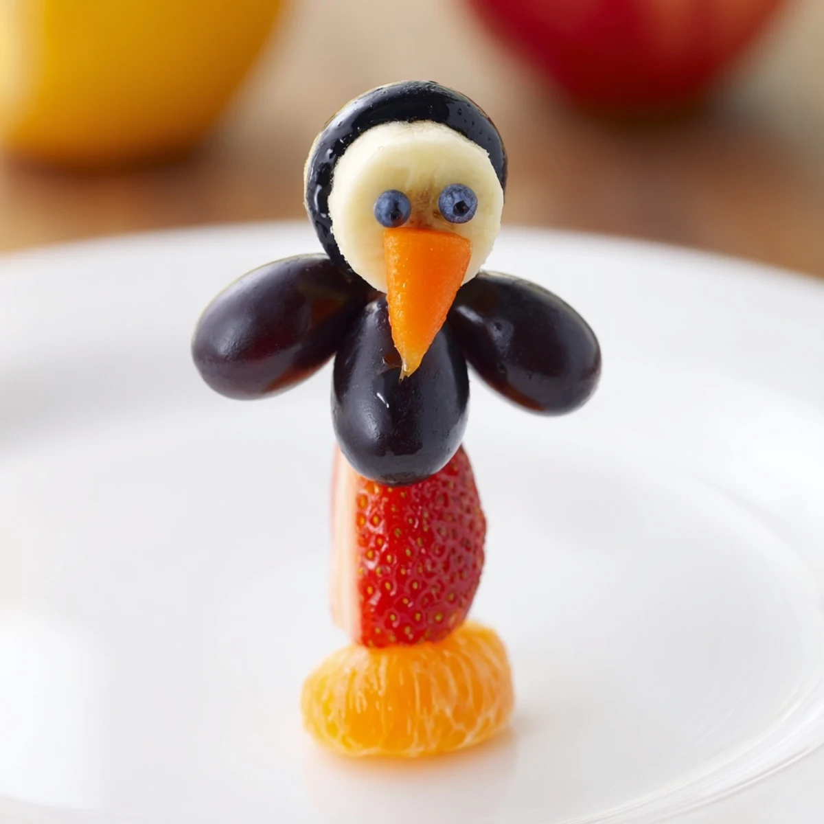 Freshly assembled Penguin Fruit Skewer Army: a vibrant and creative fruit snack idea for party treats.