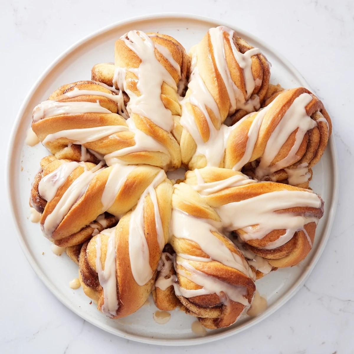 Imagine a pull-apart Giant Snowflake Sweet Roll, its soft, swirled layers coated in sweet icing.