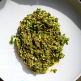 Aromatic, spicy Moroccan Chermoula Marinade ready to coat flaky fish fillets, perfect for grilling.