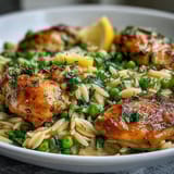 Bright and zesty one-pot lemon orzo with tender chicken, sweet peas, and a hint of garlic