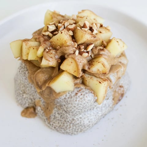 Creamy layered Apple-Chia Pudding with peanut butter, sweet apples, and a swirl of peanut butter.