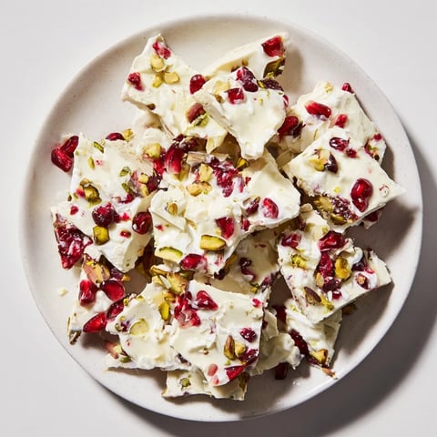 Frozen yogurt bark, bursting with jewel-toned pomegranate and crunchy pistachio pieces.