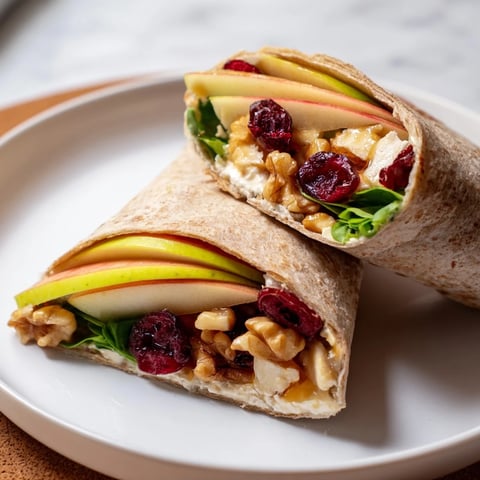 Festive Cranberry Goat Cheese & Walnut Holiday Wrap, bursting with colorful, fresh ingredients, ready to eat!