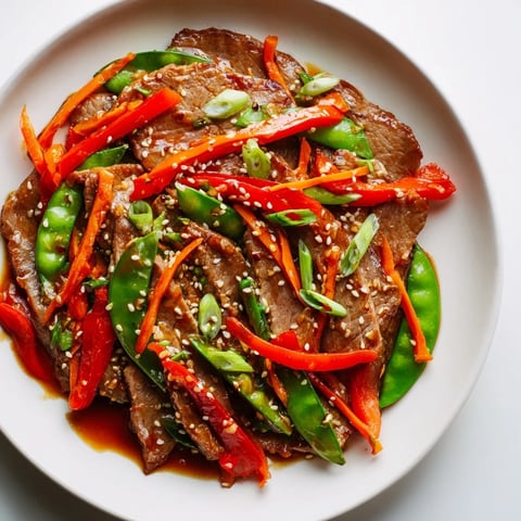 Golden-brown Sweet Teriyaki Pork Stir-Fry with glistening sauce and steamed rice, ready to enjoy.