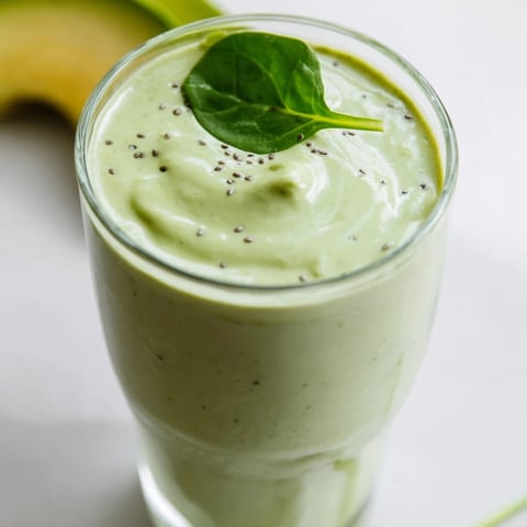 Creamy Spinach Avocado Smoothie, a bright green drink perfect for a healthy start.