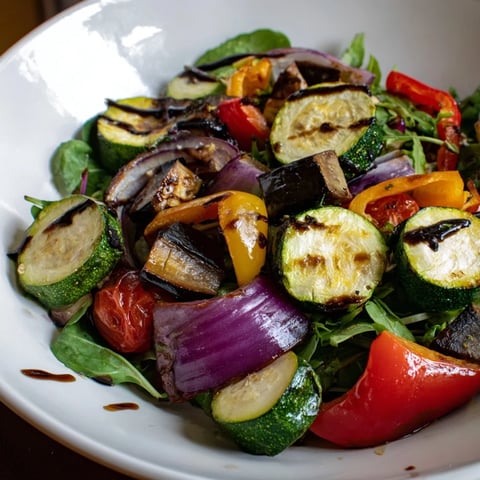A colorful Roasted Vegetable Salad, featuring perfectly roasted vegetables with a tangy balsamic dressing.