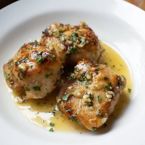 Golden-brown garlic butter chicken bites glistening in a rich, buttery sauce, ready to serve.