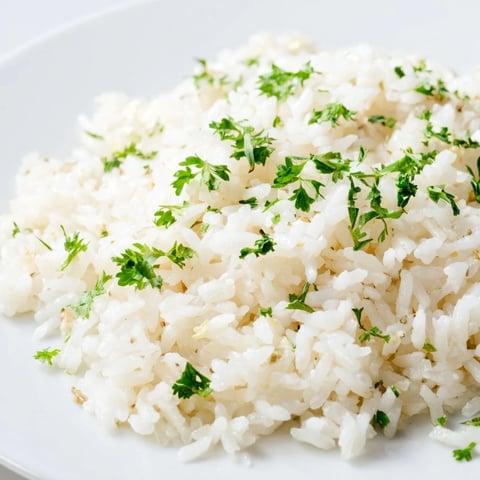 Fluffy garlic butter rice with parsley, a delicious side dish, ready to serve and enjoy.