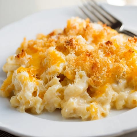 Deliciously cheesy Classic Baked Macaroni and Cheese, perfect for family gatherings.  