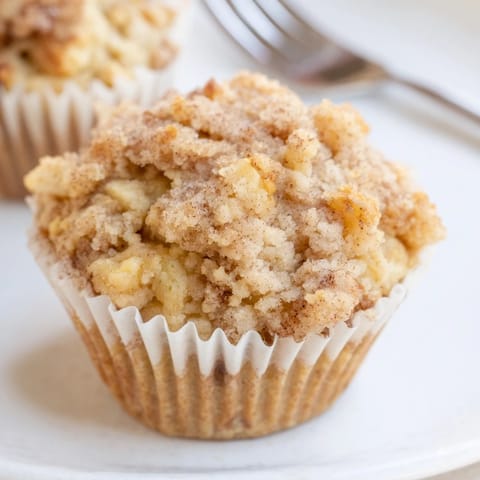Warm, fresh-baked Cinnamon Apple Streusel Muffins bursting with sweet apple and spice.  