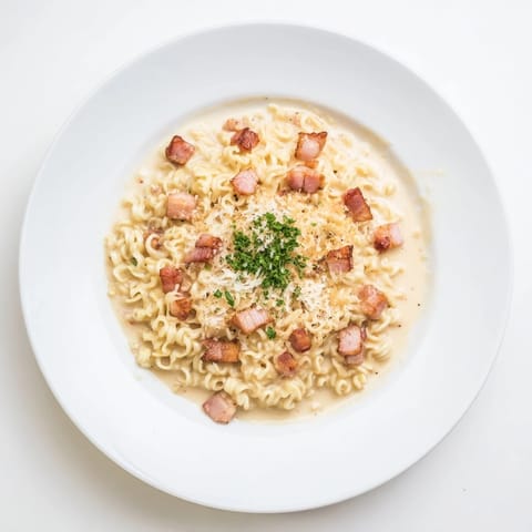 Italian-Japanese fusion Carbonara Ramen, cooked perfectly and ready for a satisfying bite.