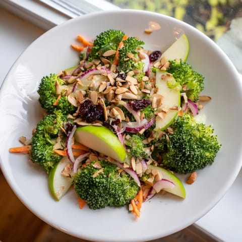 Fresh and colorful Broccoli and Apple Hot Girl Salad, with a tangy dressing and crunchy almonds ready to serve.