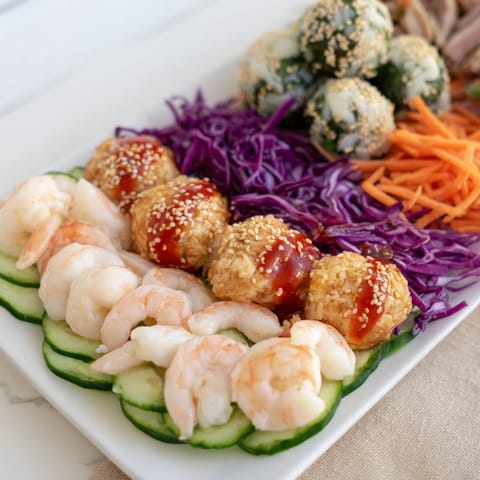 A close-up of a delightful Mighty Dragon Lunar New Year Board with dipping sauces, perfect for sharing.