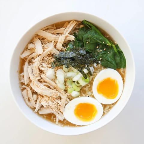 A close-up shot of rich and creamy Chicken Ramen with Kewpie Mayo, ready to be enjoyed with flavorful toppings.
