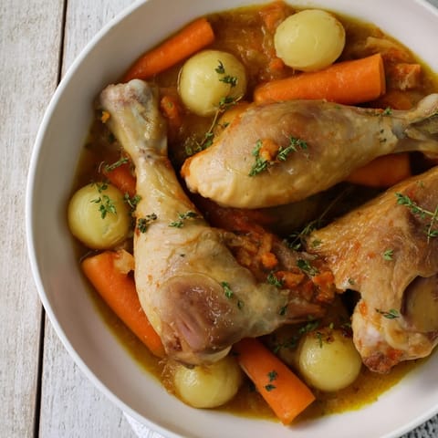 A close-up shot of the savory Georgia Pot Roast Chicken, showcasing the rich, glistening sauce and tender meat.