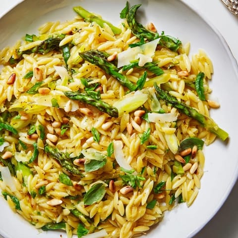 This fresh Asparagus Lemon Orzo Salad shines as a light vegetarian side dish for spring picnics or easy Mediterranean dinners.
