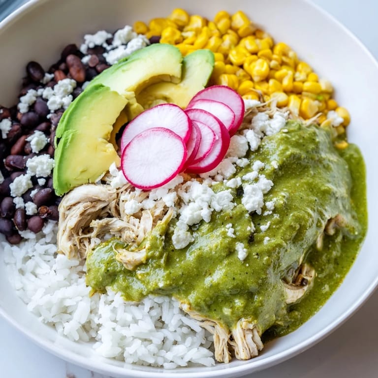 Flavorful Green Enchiladas Rice Bowl with avocado and cilantro—a quick and easy Tex-Mex dinner.