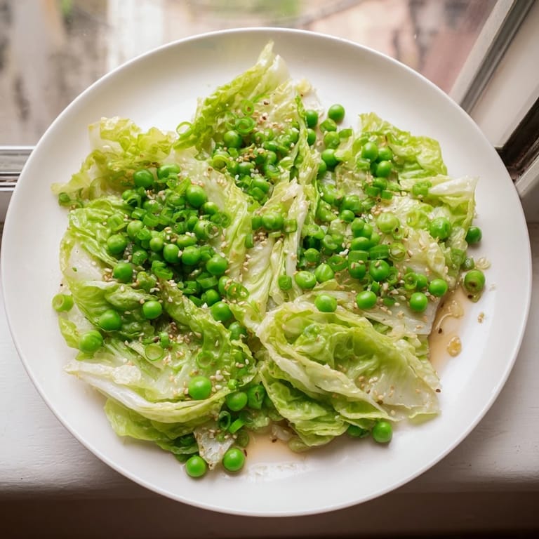 Freshly made cabbage stir-fry showcasing tender-crisp vegetables in a garlic-soy sauce, a healthy meal.
