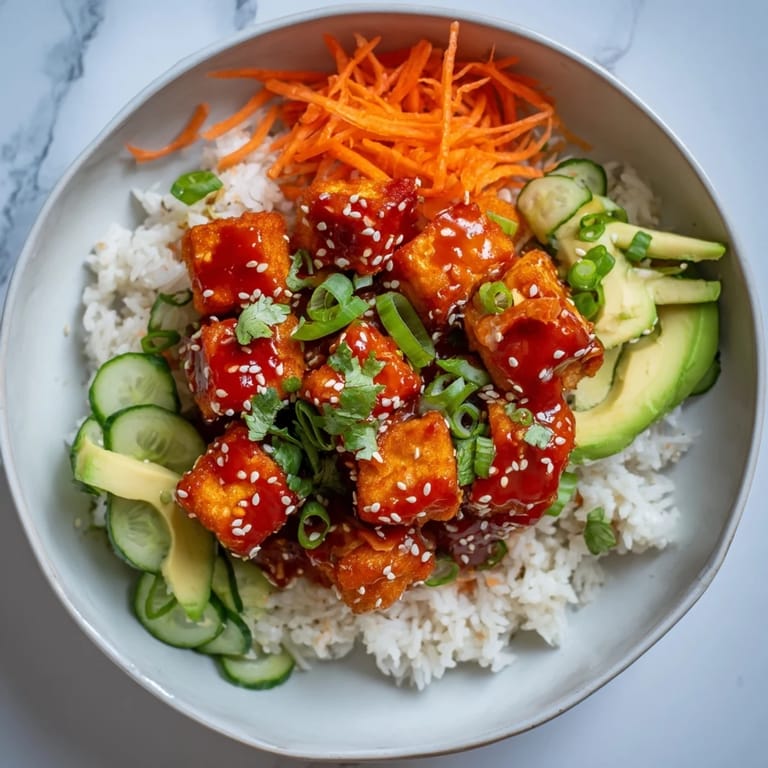 Quick and easy Chili-Mayo Baked Tofu Bowls: a comforting rice bowl topped with fresh, bright ingredients.