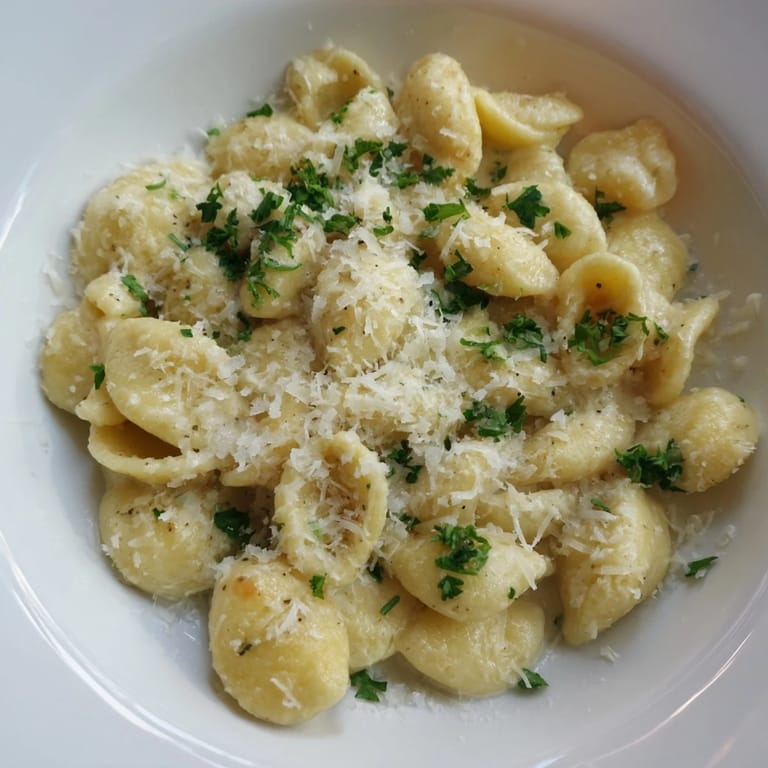 Close-up of freshly made 15-Minute Garlic Parmesan Pasta, sprinkled with parsley—a perfect weeknight meal.