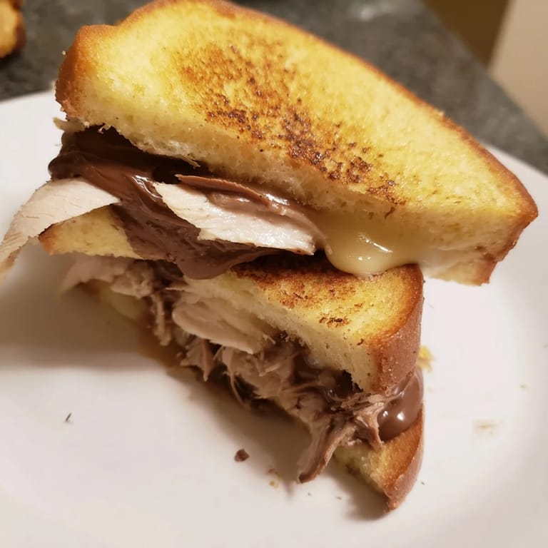 Savory and sweet: the Nutella Grilled Cheese with Chicken, a delicious fusion sandwich bursting with flavor.