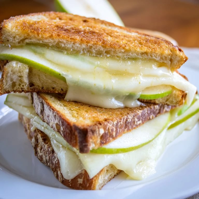 Savory Brie and Apple Grilled Cheese: Imagine warm, fruity flavors oozing between crispy, golden sourdough.