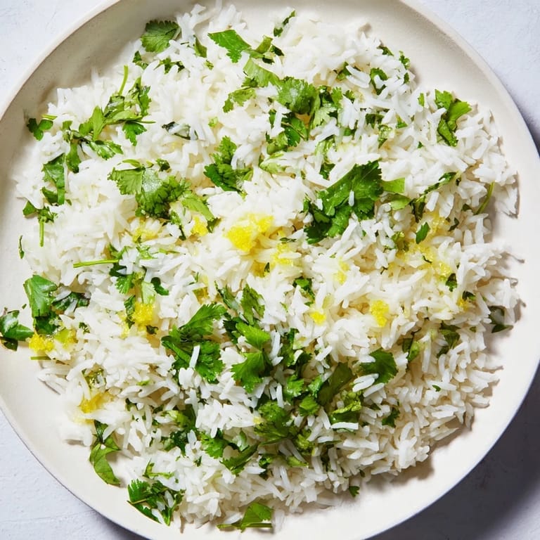Bright green cilantro lime rice, a vibrant and flavorful side dish, ready to savor with your meal.