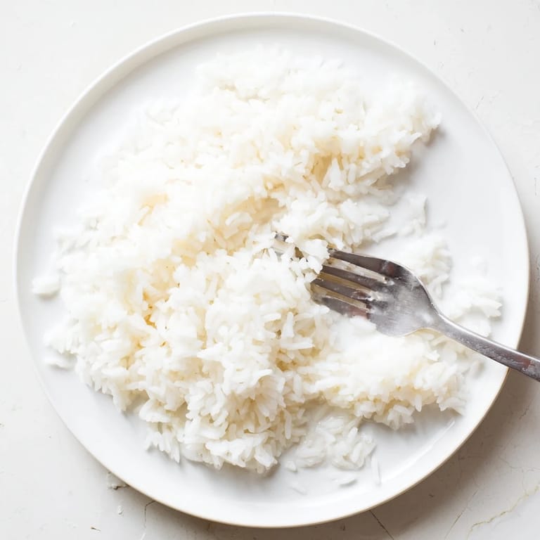 Fluffy Coconut Jasmine Rice, a vegan and gluten-free side, ready to complement your meal beautifully.
