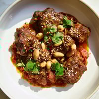 Warm Moroccan Lamb Tagine, a rich stew with tender lamb and sweet prunes, ready to serve.