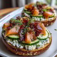 Vibrant smoked salmon bagel board with cream cheese, fresh vegetables, and herbs for an elegant spring brunch.